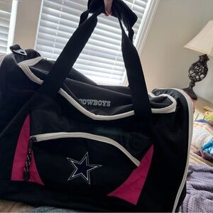 NFL brand Cowboys Black and Pink Duffel Bag
